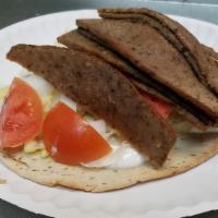 Regular Gyro · Pita bread, lamb meat, tomatoes, lettuce and onions.