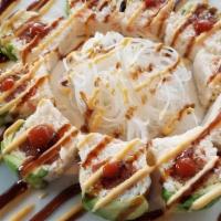 Yoda Roll · Avocado wrapped crab mix, spicy tuna, topped with spicy aioli, eel sauce, sriracha.