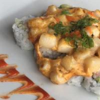 The Volcano · Cooked items. Crab, cucumber, avocado topped with baked scallops, spicy aioli, masago, green...