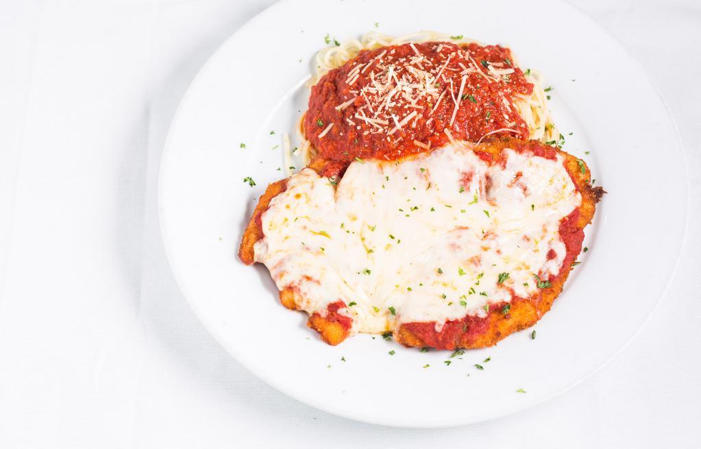 Chicken Parmigiana · Boneless, skinless chicken breast breaded and topped with parmesan and mozzarella cheese, in light tomato sauce. Oven baked.