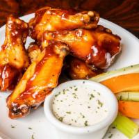 Chicken Wings · BBQ, buffalo, lemon pepper, served with ranch or blue cheese dipping sauces.