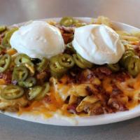 Waffles N' Cheese · Waffle fries smothered in monterrey jack, cheddar, bacon, sour cream, and jalapenos. Try a f...