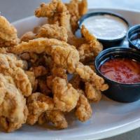 Magic Chicken · Pluckers new extra crunchy batter on tender chicken strips served with your choice of 2 wing...