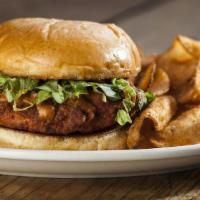 Buffalo Chicken Sandwich · A hand-breaded and fried chicken breast tossed in your favorite wing sauce and served with y...