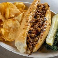 South Philly Cheesesteak · Smothered in grilled onions and queso.