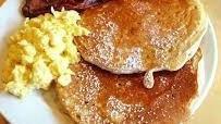 Pancake Plate · 2 pancakes, scrambled eggs, choice of bacon or sausage.