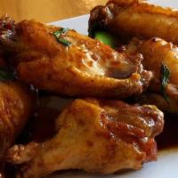 Basil Crispy Wings · Fried seasoned chicken wing, sautéed in sweet chili sauce, basil, bell pepper.