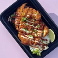 Fried Chick'N Katsu Box · Crispy Chick'n Filet silced over a Bed of Slaw and Short Grain Rice served with Tonkatsu Sau...
