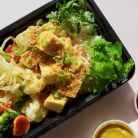 Yellow Curry Fried Tofu Box · Vegan. Base: 1/2 short-grain rice, 1/2 steamed cauliflower, carrot, broccoli, cabbage. Prote...
