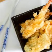 Shrimp Tempura · Three pieces of deep fried shrimp and vegetables.
