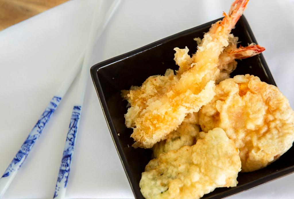 Shrimp Tempura · Three pieces of deep fried shrimp and vegetables.