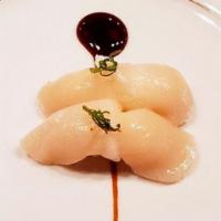 Scallop · Scallop cooked in garlic butter and soy sauce with a squeeze of lemon and teriyaki sauce.