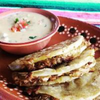 Queso Dip Tacos · 3 pork tacos, toasted in a homemade tortilla with cheese, onion, and cilantro. Comes with ou...