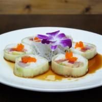 Oishi Roll · Yellowtail, tuna, salmon, shrimp, crab, mango with cucumber wrap.