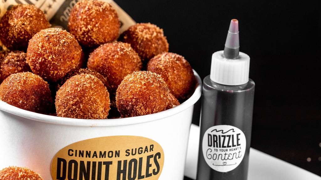 Donut Holes (1810 Cals) · 24 warm, cinnamon sugar donut holes served with chocolate sauce.
