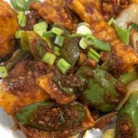 Chilly Fish · Battered fried tilapia fish stir-fried with sweet pepper, green chilies, onions & homemade r...