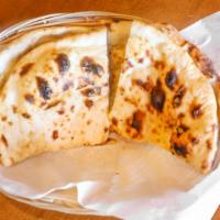 Butter Naan · Traditional Indian bread baked in clay oven with a hint of fresh butter.