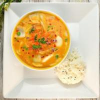 Yellow Curry · Potatoes, coconut milk carrots, peas, white onions.