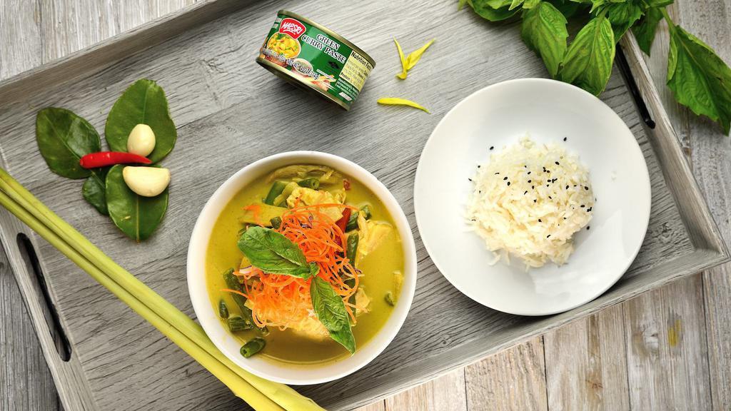 Green Curry · Coconut milk, bamboo shoot, bells, green beans, and basil leaves.