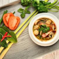 Tom Yum · Thai clear hot and sour soup, mushroom, onions, tomatoes and fresh lime juice chicken or shr...