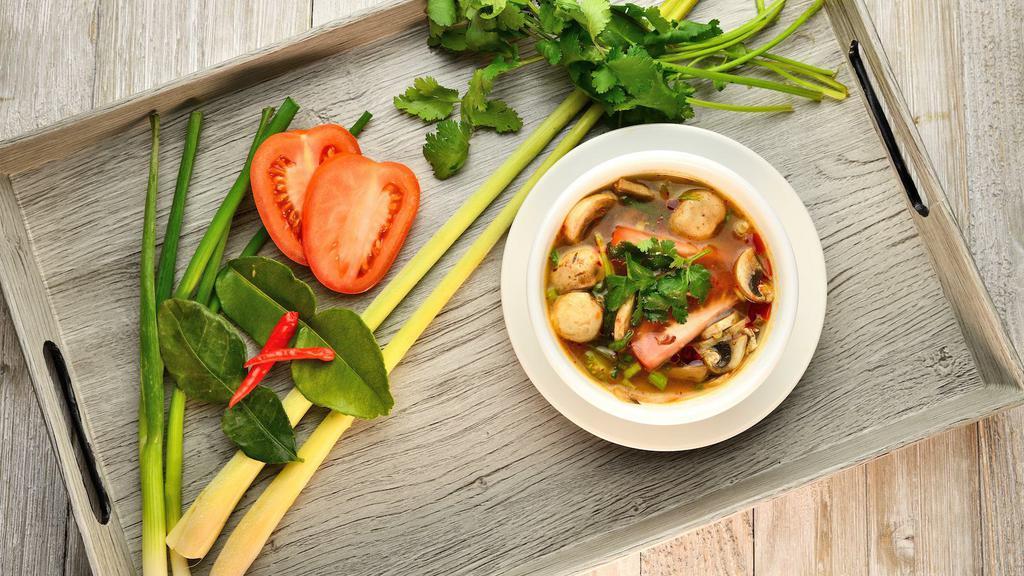 Tom Yum · Thai clear hot and sour soup, mushroom, onions, tomatoes and fresh lime juice chicken or shrimp.