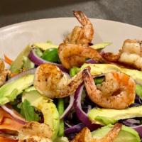 Grilled Shrimp Salad · 8 pieces of grilled shrimp in a bed of crispy greens, mixed with tomatoes, avocado, green on...