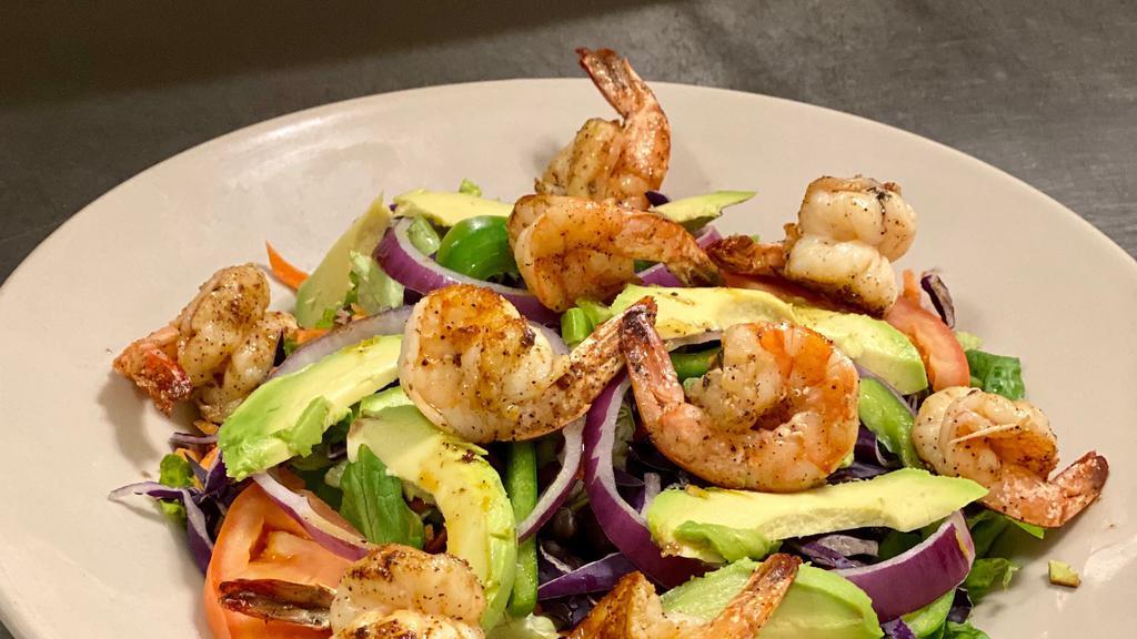 Grilled Shrimp Salad · 8 pieces of grilled shrimp in a bed of crispy greens, mixed with tomatoes, avocado, green onions, red onions, bell peppers, carrots, red cabbage and black beans and jack cheese
