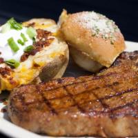 T-Bone Steak · 16 oz steak cooked to perfection, loaded baked potato and a dinner salad.
