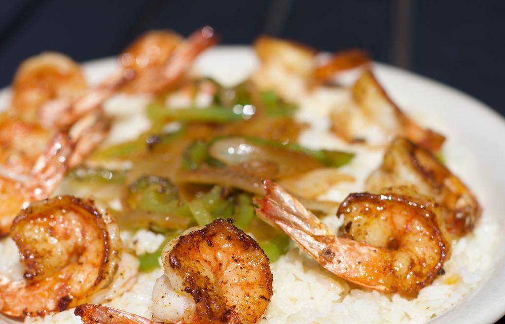 Grilled Shrimp Platter · Jumbo shrimp grilled to perfection served over a bed of rice, onion and bell pepper sautéed.