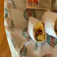 Breakfast Burrito · Scrambled eggs, onions, and peppers with choice of ham, bacon or sausage, with a side of sal...