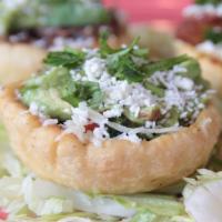 Traditional (Sopes) · Our own homestyle sope with refried beans, Monterey jack cheese, guacamole, cilantro, pico d...