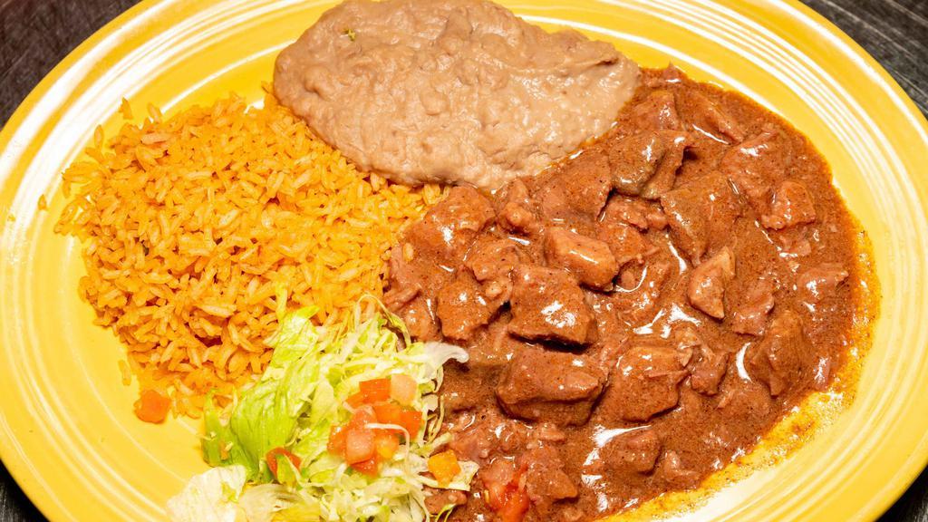 Carne Guisada Plate · Served with homemade flour tortillas, refried beans, and rice or sub beans and rice for the side of vegetables (combo of mushrooms, tomatoes, onions, zucchini, and yellow squash).