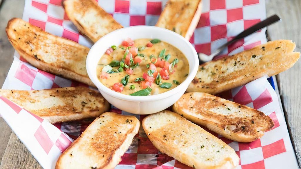 Cajun Fondue · Your choice of shrimp, crawfish or chicken in a creamy cheese sauce. Garlic toast.