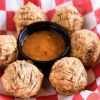 Boudin Balls · Traditional Cajun pork and rice sausage with spicy sauce.
