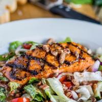 Hurricane Glazed Salmon Salad · Greens, red onion, tomato, cucumber, pecans, with choice of dressing. Topped with our Hurric...