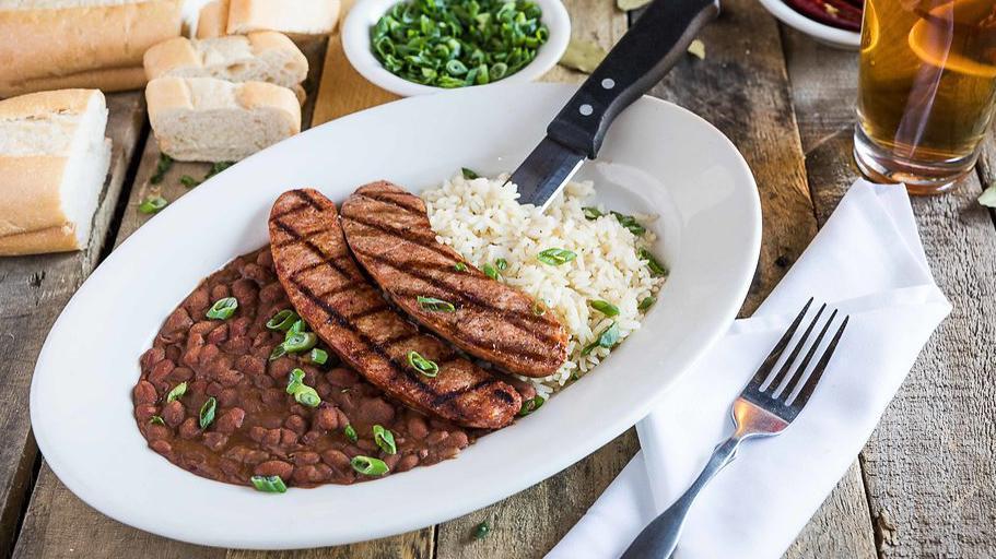 Andouille Sausage Over Red Beans & Rice · A Cajun sausage tradition.