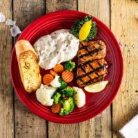 Hurricane Salmon · Grilled Salmon filet brushed with sweet and spicy hurricane glaze. Mashed potatoes and side ...