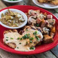 Chicken Tchoupitoulas · Grilled breast over potatoes, ham and mushrooms. Lemon butter.
