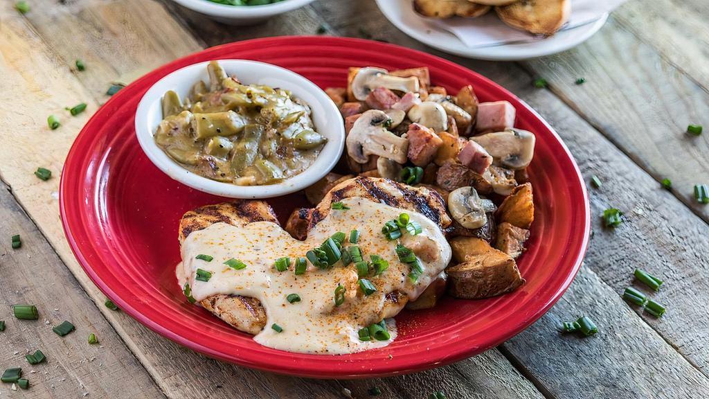 Chicken Tchoupitoulas · Grilled breast over potatoes, ham, and mushrooms. Lemon butter.