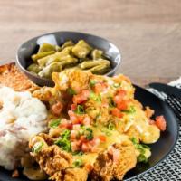 Creole Pork Chops · Hand Battered and Perfectly Fried Pork Chops. Smothered with Jalapeno Cheese sauce. Served w...