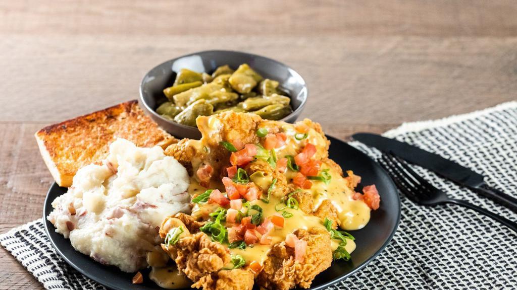 Creole Pork Chops · Hand Battered and Perfectly Fried Pork Chops. Smothered with Jalapeno Cheese sauce. Served with Mashed potatoes and Green Beans.