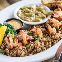 Shrimp En Brochette · Shrimp stuffed with jalapeno and wrapped in bacon! Over dirty rice.