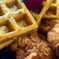 Chicken And Waffles · Three hand battered chicken tenders and homemade buttermilk  waffles. Served with butter and...