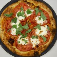 Margherita Pizza · One of our favorites. Marinara, fresh mozzarella, Parmesan and Romano, roma tomatoes, and fr...