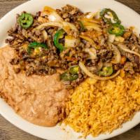 Mexican Steak · Beef chunks with jalapeño, onions, rice & refried beans