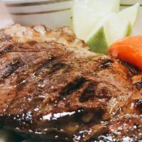 Ribeye Steak · A juicy mouthwatering 10 oz select rib eye steak slow grilled to maintain the succulent flav...