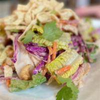 Crunchy Asian Chopped Salad · romaine, cabbage, red bell peppers, carrots, cashews, wonton strips, cilantro, honey lime vi...