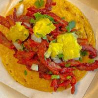 Taco Al Pastor · Corn Tortilla, Marinated Pork, Onions, Cilantro and Pineapple
