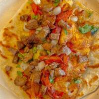 Campechana · Flour Tortilla, Carne asada and Al Pastor mixed with cheese, Onions & Cilantro.
