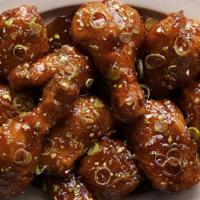 Galbi Wings · A lightly sweet and savory sauce that has a off the grill flavor. Mixed with green onions an...